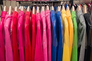 Long sleeved multicolored shirts hanging